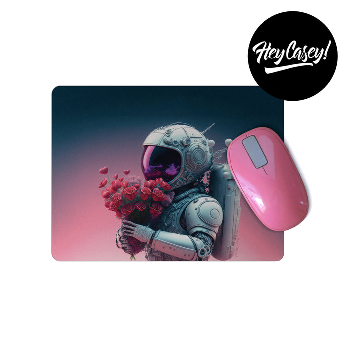 A mouse pad with a print of a sci-fi astronaut holding a bunch of flowers
