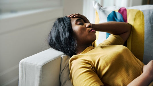 woman resting on a couch