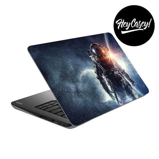 vinyl laptop skin with an astonaut, moon and galaxy design