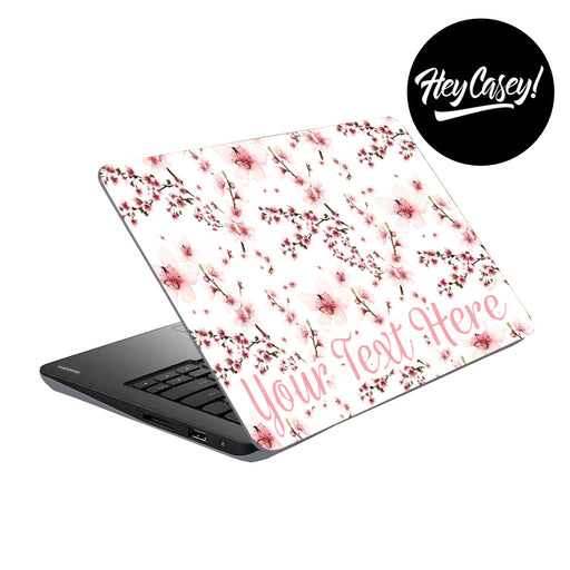 vinyl laptop skin with a pink cherry blossom design