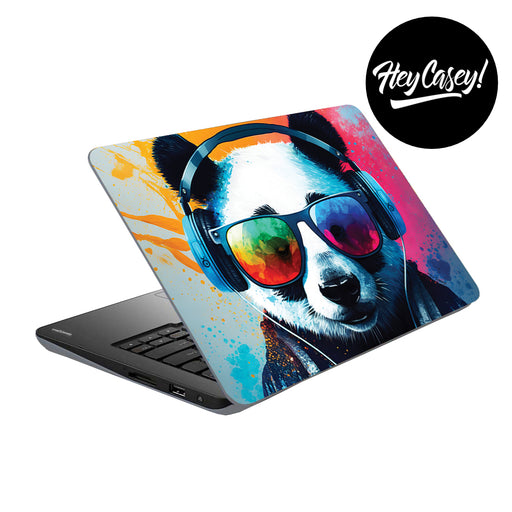 vinyl laptop skin with a painted design of a panda bear with headphones and sunglasses and cheerful colours