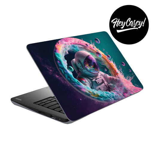 vinyl laptop skin with a funky space design of an astronaut 