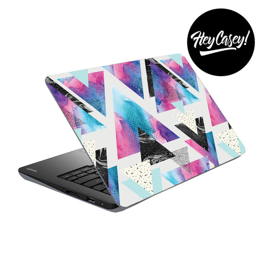 vinyl laptop skin with a geometric design made up of triangles and textures