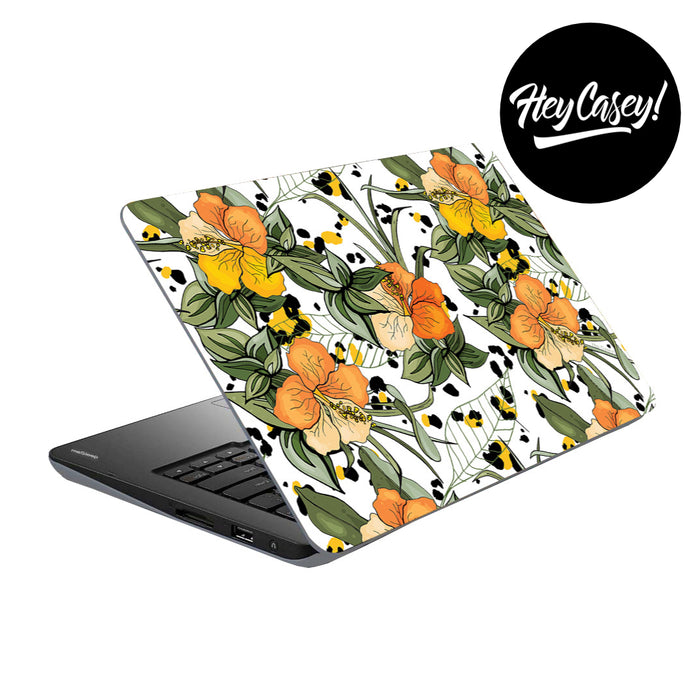 vinyl laptop skin with design of yellow and orange hibiscus flowers and leaves