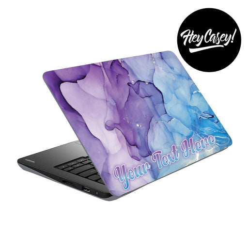 vinyl laptop skin with a blue and purple ink design
