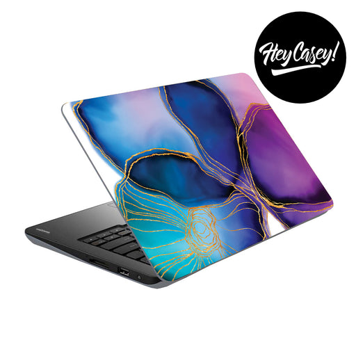 vinyl laptop skin with bold watercolor design reminiscent of a flower