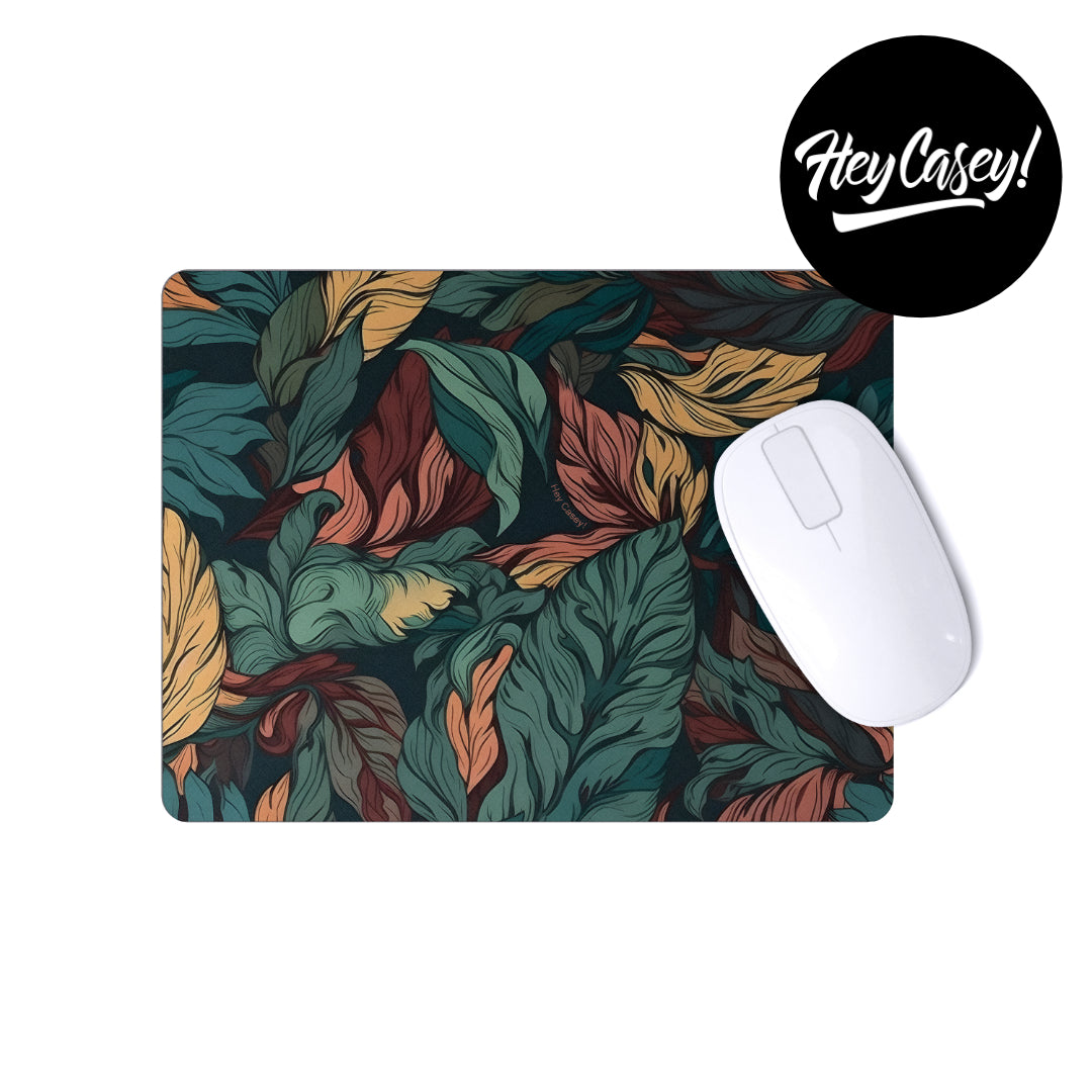 a mouse pad with autumn leafe design
