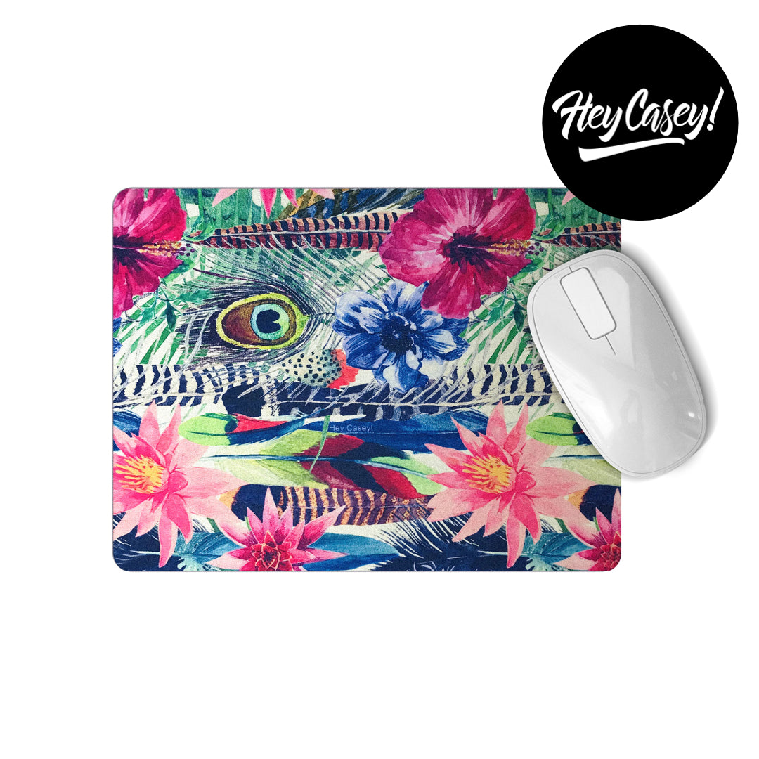 Printed mouse pad with a tropical floral and feather design