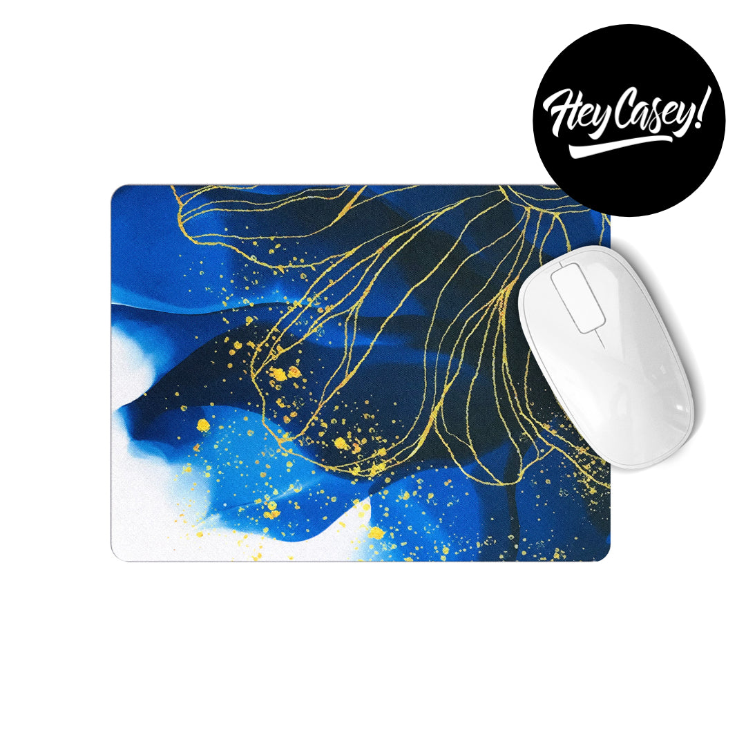 mouse pad with a modern pen and ink design in blue and gold